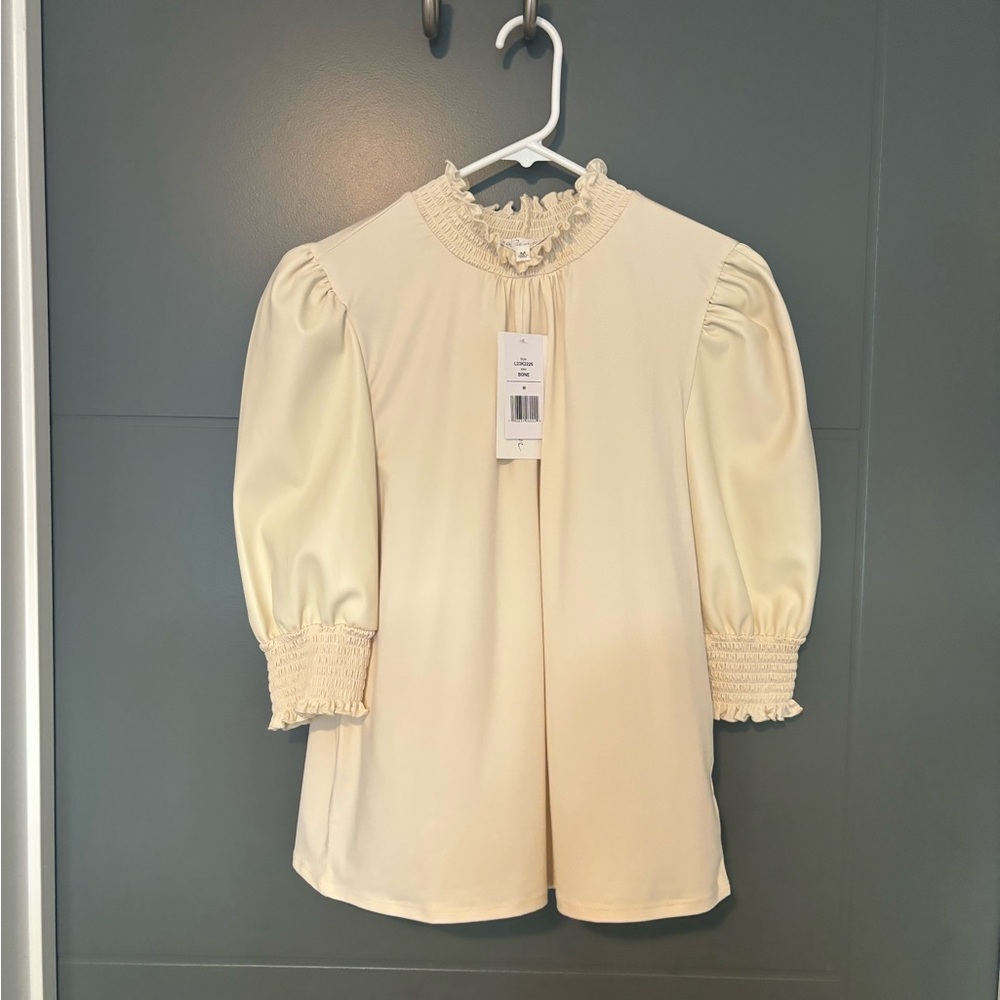Blouse with pleather sleeves